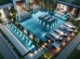 image graphique représentant une piscine à débordement hors sol luxueuse avec des lignes géométriques épurées, située dans un jardin moderne. La piscine utilise des matériaux de haute qualité tels que le verre et la pierre, et inclut un éclairage LED intégré, un système de chauffage puissant, et des chaises longues confortables autour. La zone est paysagée avec des plantes tropicales et une terrasse élégante en pierre naturelle. Une cascade moderne et des jets ajoutent un attrait visuel, tandis que des barrières de sécurité et des couvertures automatiques assurent la sécurité. La scène met en avant le mélange de luxe, de fonctionnalité et d'améliorations esthétiques dans une piscine à débordement bien conçue.